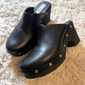 Steve Madden black studded clogs.